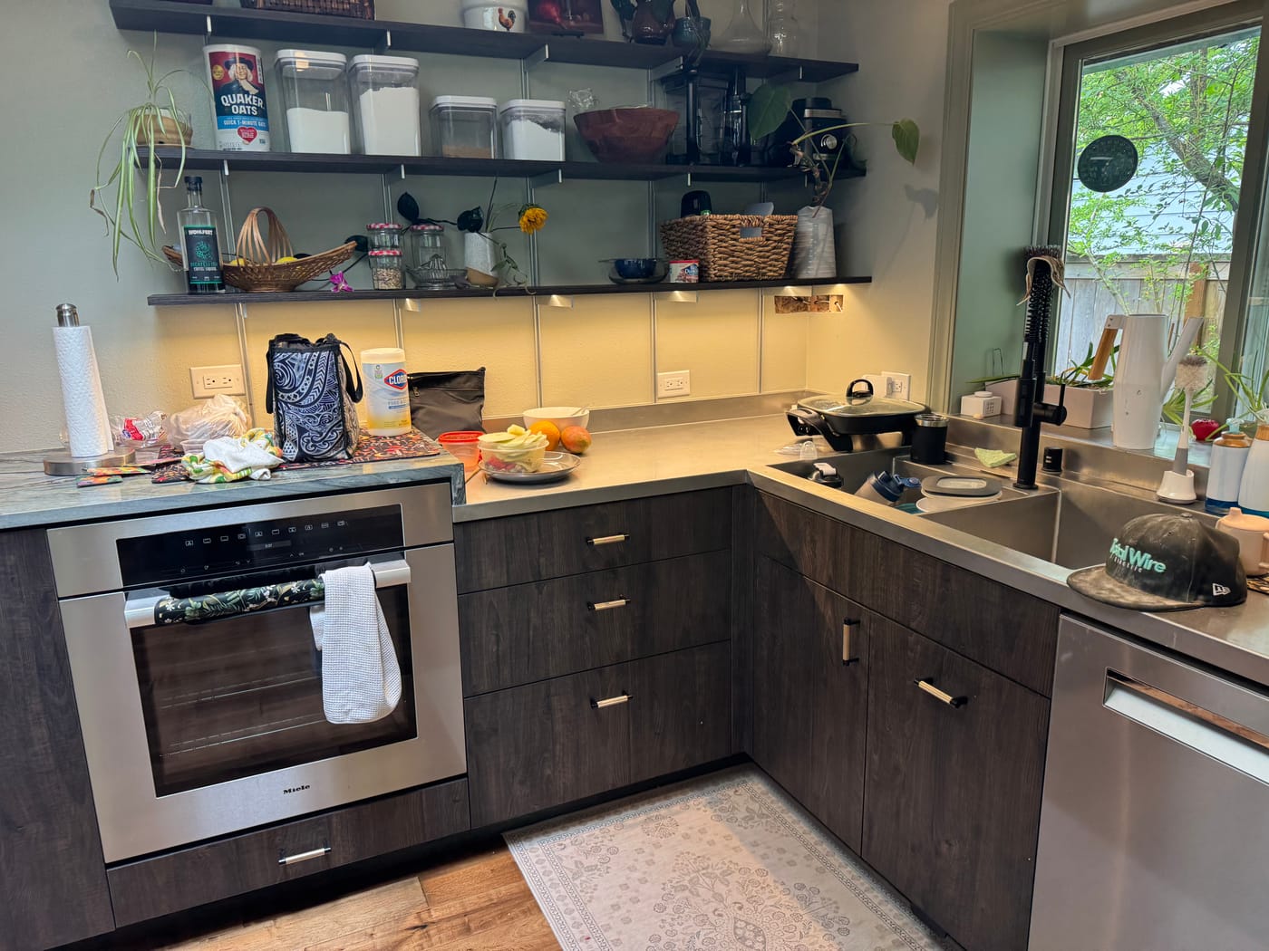 Dark-cabinet kitchen with recessed and under-cabinet lighting