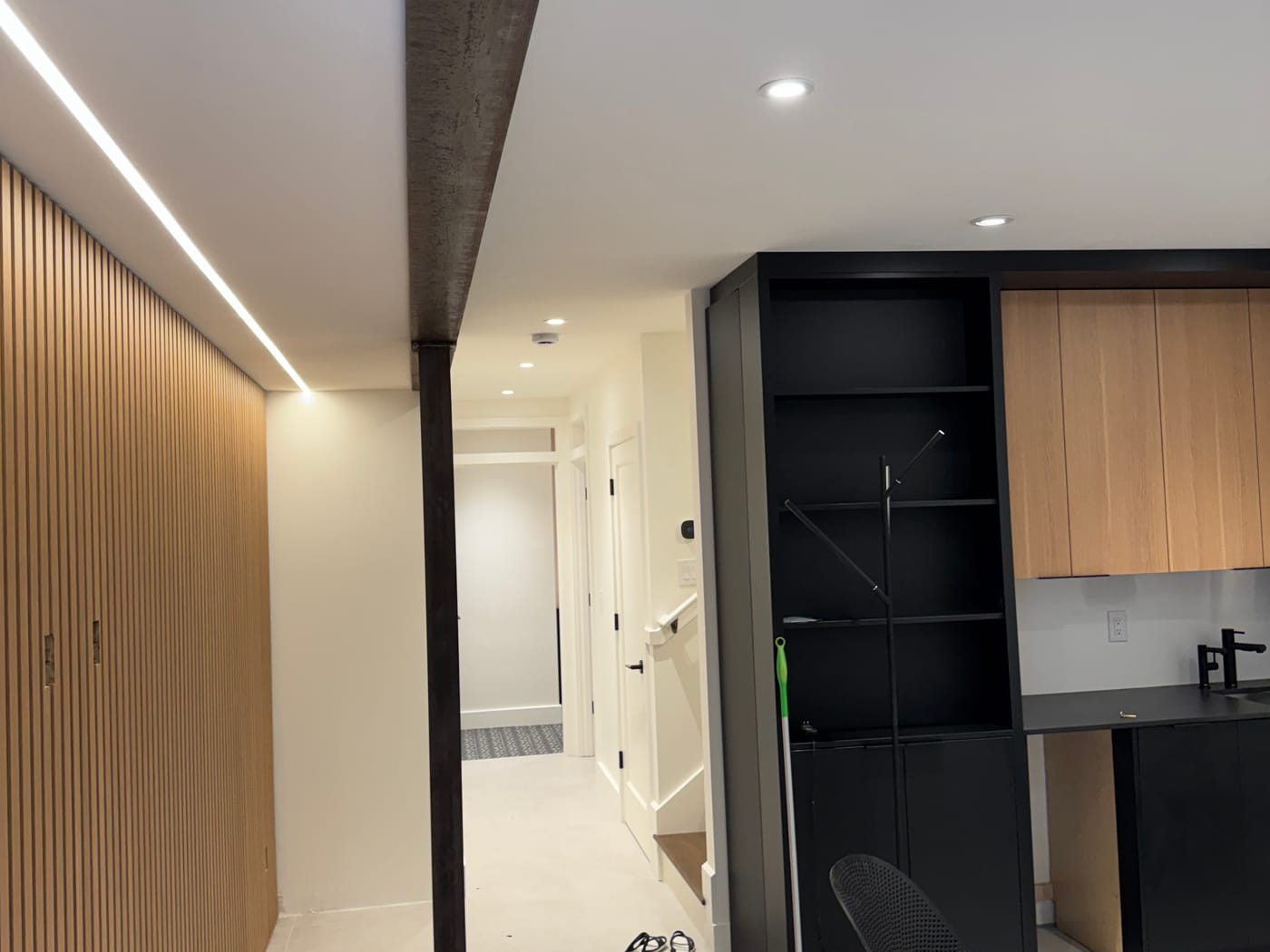 Wood-slat feature wall with concealed LED cove lighting